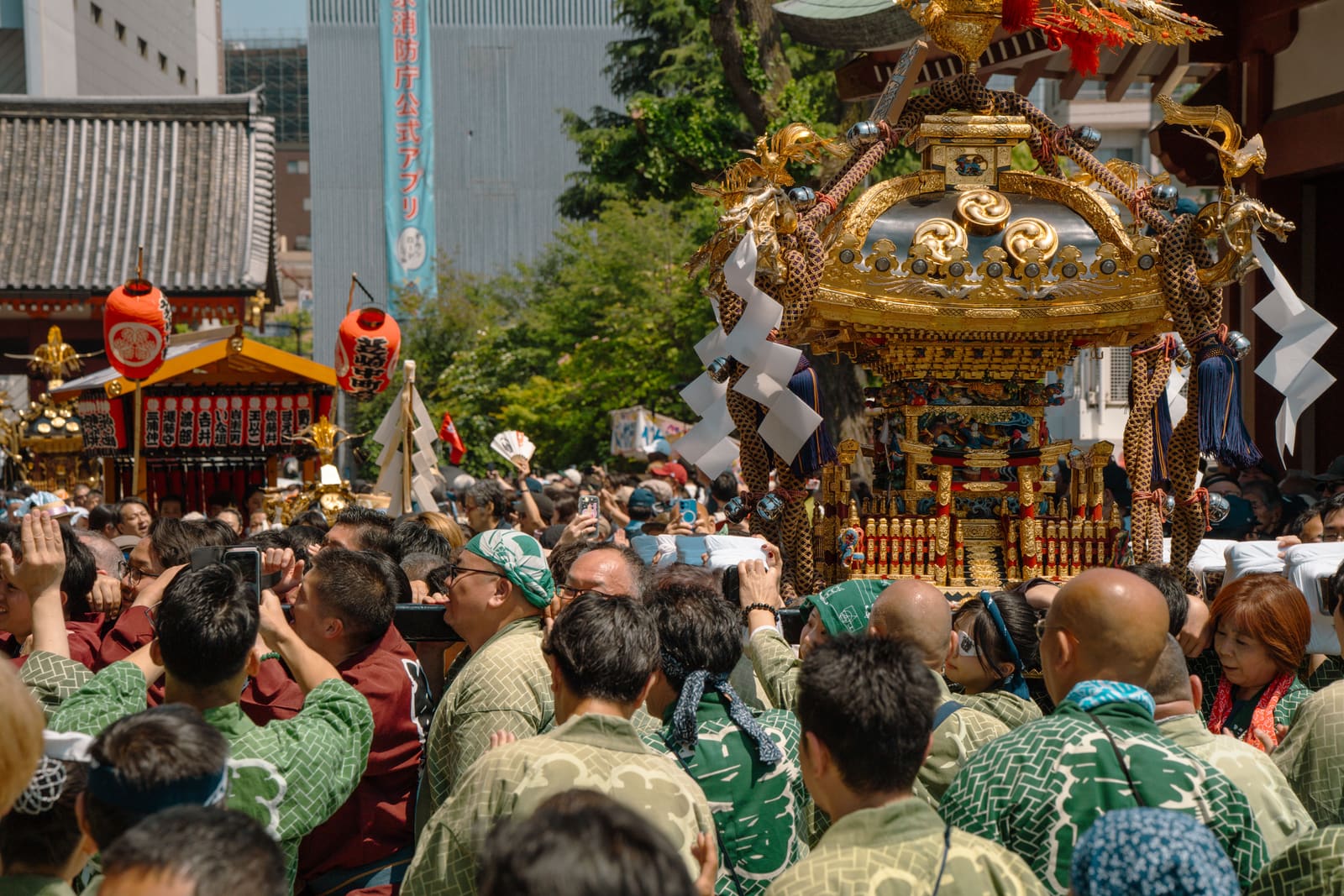 Crowded festival procession in Japan during peak summer holiday season